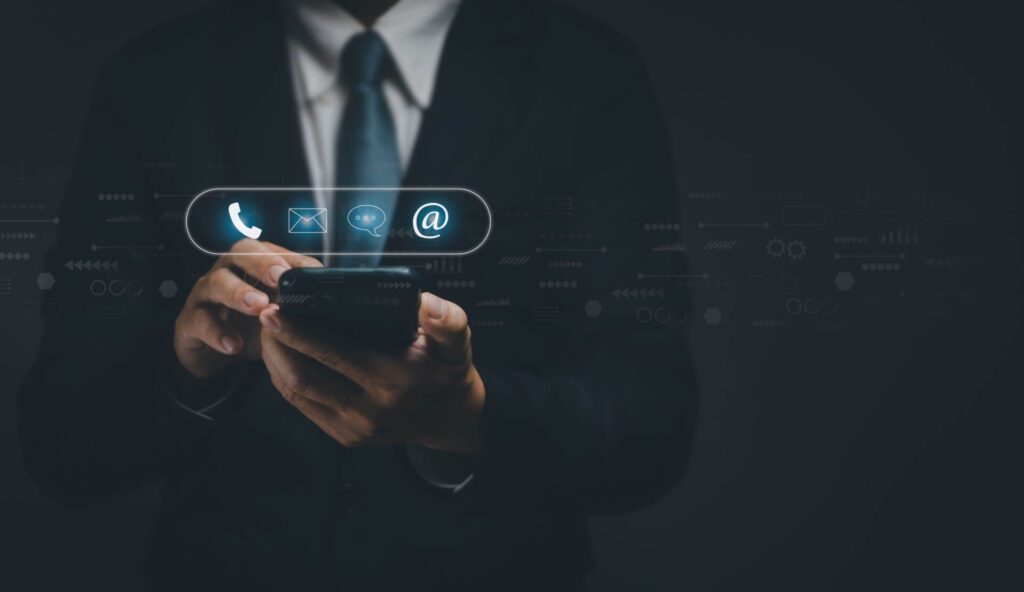 Businessman using smartphone to display contact to send information to customers, concept of using internet technology to contact customers